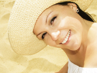 woman in sunhat on the beach