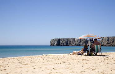 A couple of senior man and woman, in a beach, Algarve