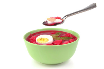 red vegetable soup over white