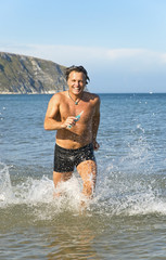Man running in the sea.