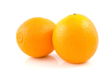 Two fresh oranges on white background