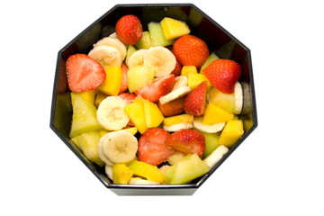 Bowl with fresh fruits over white background