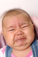 Four month old baby girl crying