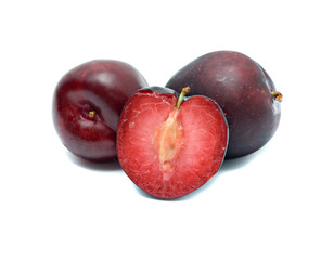 Plums and section isolated on white background