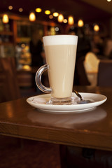 Latte coffee in tall glasse on a cafe table