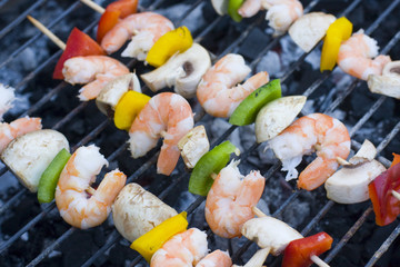 some shrimp skewers on barbecue