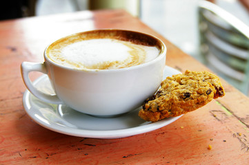 cup of coffee and an oatmeal raisin cookie