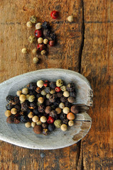 Fototapeta premium Colorful Peppercorns on a Wooden Spoon