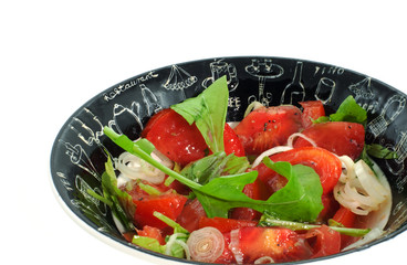 tomatoes salad in a bowl on white background
