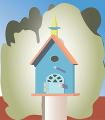 A colorful birdhouse in a tree