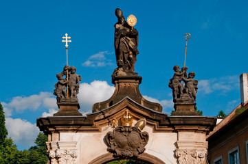 Fototapeta na wymiar monastery gate with sculpture of saint norbert