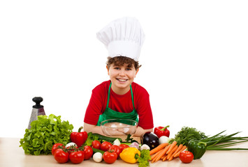 Healthy eating - boy and fresh vegetables isolated on white