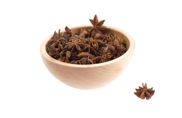anise stars in a wood bowl