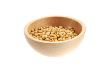 pine nuts in a wood bowl