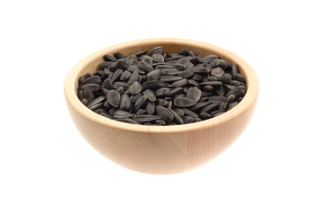 sunflower seeds in a wood bowl