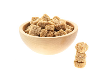 brown sugar cubes in a wood bowl