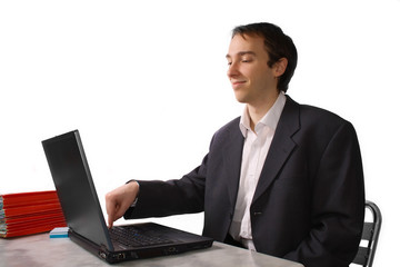 Young man proudly finishes work on laptop