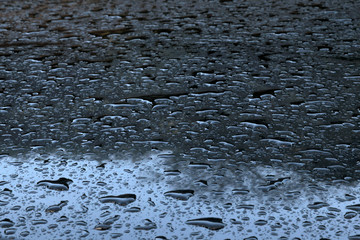 Texture of a polished metal with water droplets