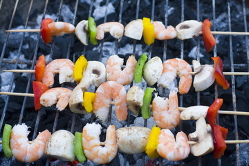 some shrimp skewers on barbecue