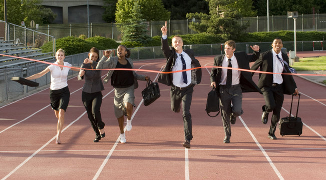 Business People Running Across the Finish Line
