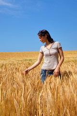 Woman in a field of wheat