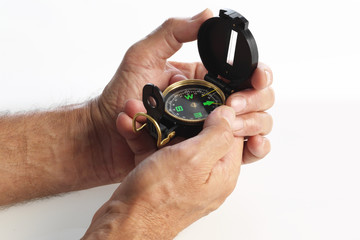 Eldery patient's hands holding compass