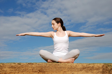Fototapeta na wymiar Young woman meditating