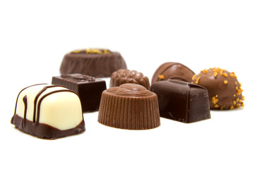 Chocolate bonbons on white background