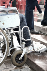 Fototapeta premium woman - invalid tries to overcome ladder steps