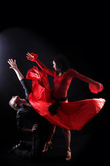 dancers against black background