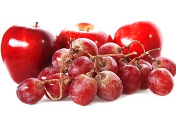 fresh red grape and apples isolated on white
