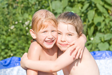 Little girls in the pool