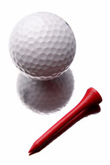 Golf ball and tee on white background
