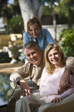 Portrait of family relaxing on patio together