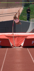 Girl pole vaulting