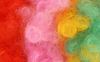 close up details of colorful clown wig hair