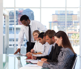 Afro-American manager working with his team