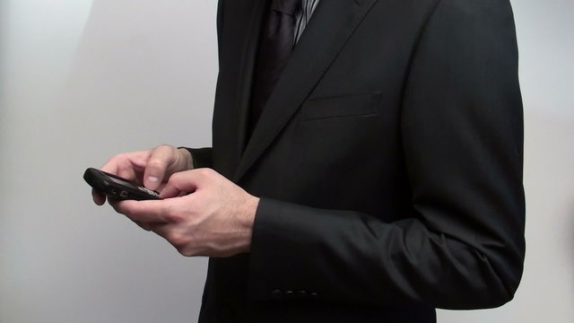 Texting businessman - HD