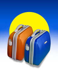 Two bright colored suitcases and sun