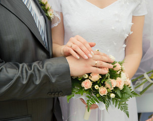 Hands of a newly-married couple