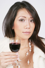 woman holding wine thoughtfully