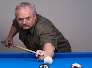 man playing pool