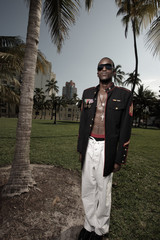 Military man posing with his jacket unbuttoned