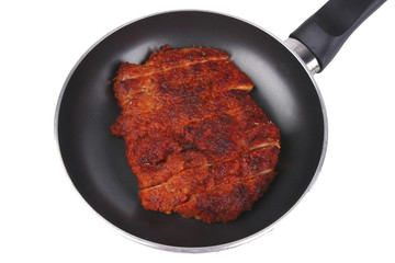 chicken meat on fry pan