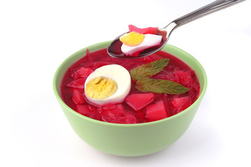 red vegetable soup over white