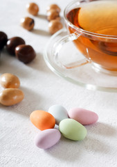 Fototapeta na wymiar colored sweets and tea