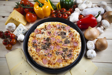 Vegetables with a pizza