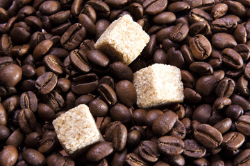 Cane sugar on coffee beans background