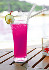 isolated glass with red drink