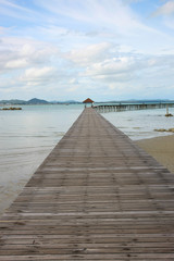 a photo of wooden bridge on sea